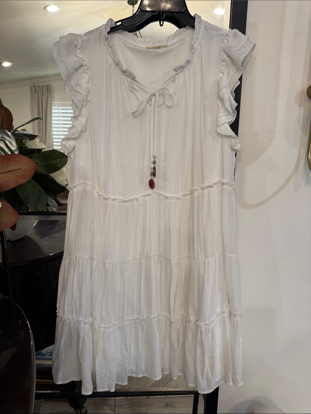 White Ruffle-Tiered Mini Dress with Tie-Neck & Beaded Tassel